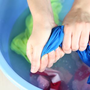 Hand Washing Laundry in a Bucket